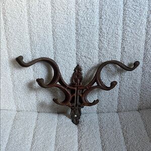 Cast iron rusted swing arm coat hanger rack wall mount